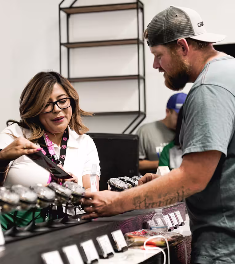 Premium Blossom - Friendly Cannabis Budtender Assisting a Customer at Premium Blossom Dispensary in Porterville, CA